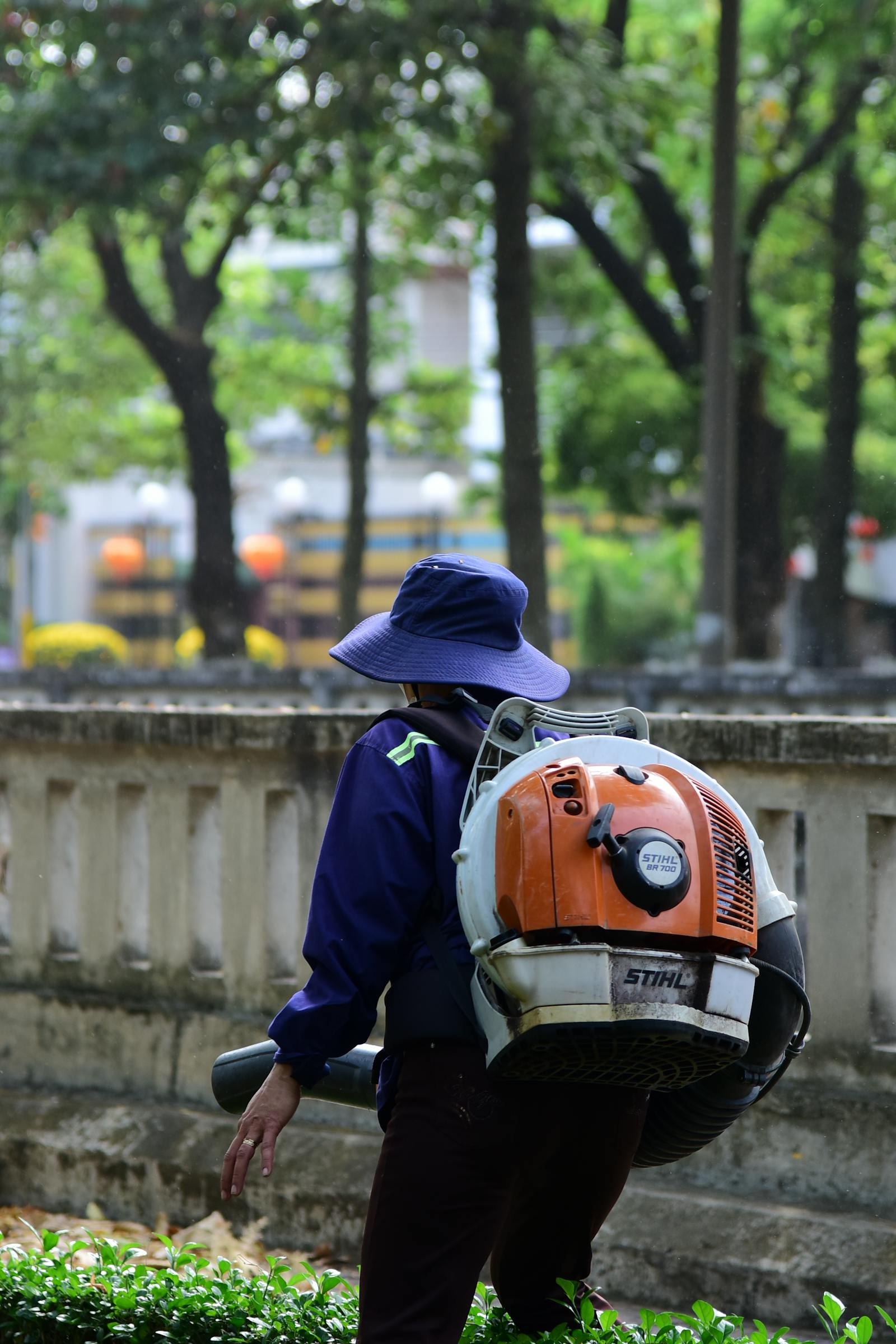 Backpack blower clearing a walk at the end of a service visit.